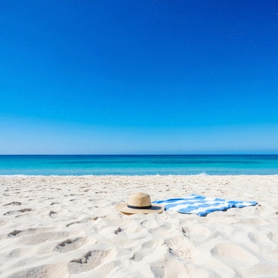 Relaxing sunny beach scene with turquoise water and soft white sand