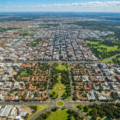 Aerial view of green parklands surrounding Adelaide city grid